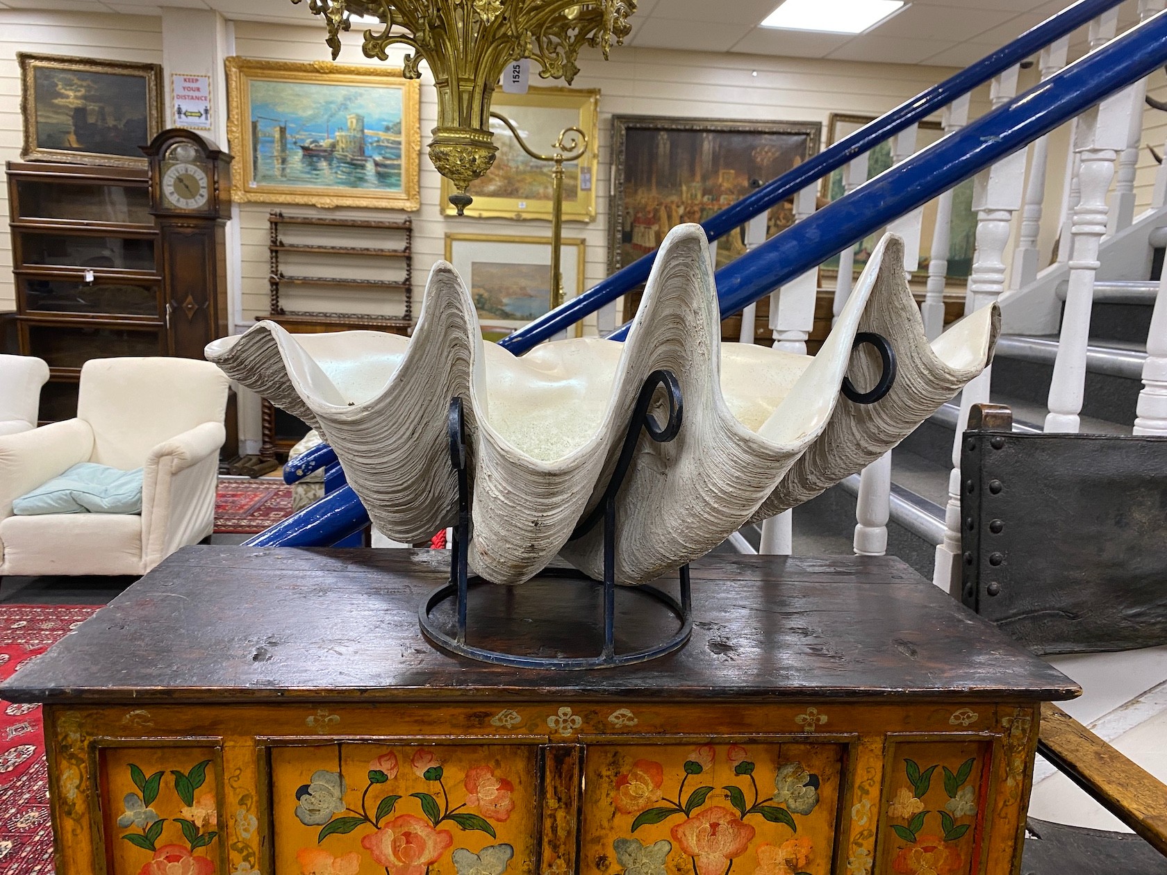 A large simulated clam shell, on stand, width 82cm, height 42cm